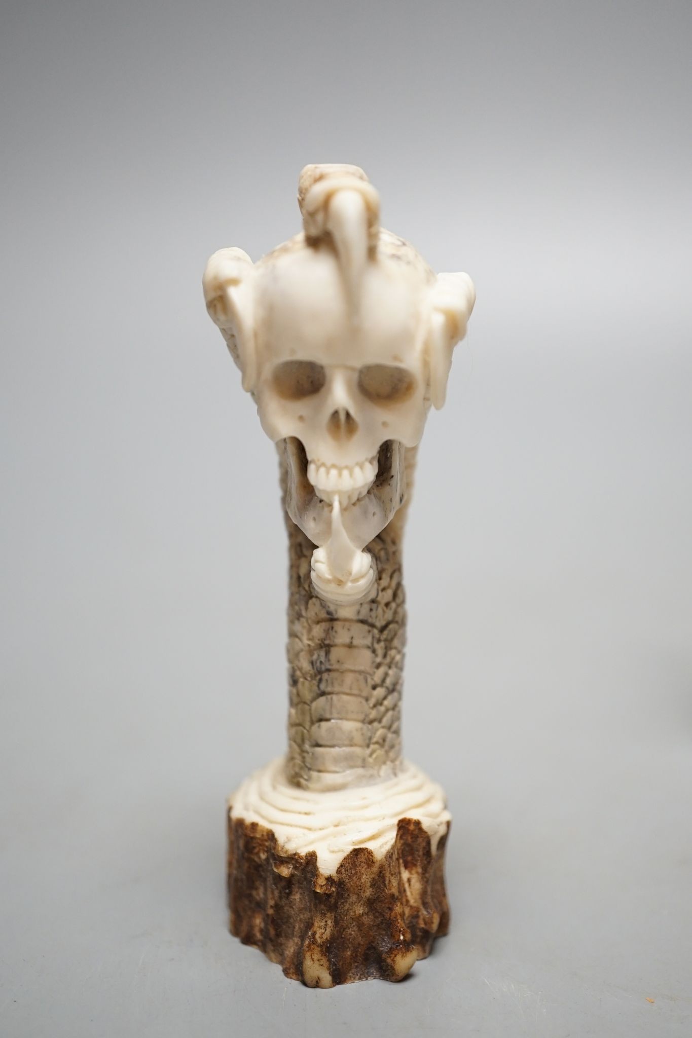 Two Japanese stag horn handles - eagle's head and a memento mori, eagle-head 13.5 cms high.
